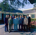 Group Photograph in Front of Building, D by George Skip Gandy IV