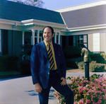 Business Professional in Front of Building, L by George Skip Gandy IV