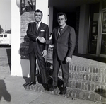 Two Men Shaking Hands Outside of Building, B by George Skip Gandy IV