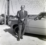 Salesman At Car Dealership by George Skip Gandy IV