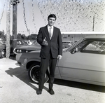 Auto Sales Consultant in Front of Car by George Skip Gandy IV