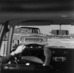 Interior View of a Car with Jeep Wagoneer In Front, C by George Skip Gandy IV