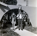 Family Standing by an Arched Walkway, A by George Skip Gandy IV