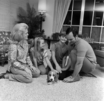 Family Playing with a Dog in the Living Room, I by George Skip Gandy IV