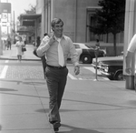 Man Walking Past Madison Street, Tampa, Florida, C by George Skip Gandy IV