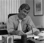 Man Talking on Phone at Desk, Tampa, Florida, A by George Skip Gandy IV