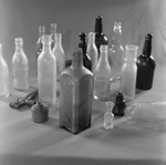 Collection of Glass Bottles and Small Containers, A by George Skip Gandy IV