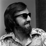 Man Wearing Sunglasses and Printed Shirt, B by George Skip Gandy IV