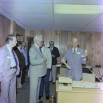 Jim Ferman Holds Phone in Office, Ferman Chevrolet Event