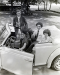 General Telephone and Electronics Corporation Employees in a Volkswagen Beetle Convertible, T by George Skip Gandy IV