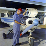 Al Ford in Front of Tampa Police Plane Tillie the Toiler, H by George Skip Gandy IV