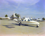 Mitsubishi MU-2 Twin-Engine Aircraft Parked on Tarmac by George Skip Gandy IV