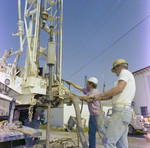 Workers Operating Drilling Equipment at Dry Dock in Tampa, Florida, E by George Skip Gandy IV