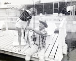 Two People Fishing from Dock at Gulf Harbors Condominiums, New Port Richey, Florida, A