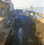 Workers Clearning Debris and Parts from a Old Corroded Ship, C by George Skip Gandy IV