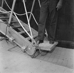Person Inspecting Metal Equipment Invovled in an Accident, D by George Skip Gandy IV