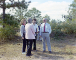 Businesspeople Stand in Field for M-C Development, A by George Skip Gandy IV