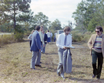Businesspeople Stand in Field for M-C Development, C by George Skip Gandy IV