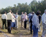 Businesspeople Stand in Field for M-C Development, E by George Skip Gandy IV