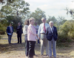 Businesspeople Stand in Field for M-C Development, H by George Skip Gandy IV