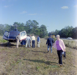 Businesspeople Gather by Helicopter in Field for M-C Development, D by George Skip Gandy IV