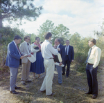 Businesspeople Stand in Field for M-C Development, O by George Skip Gandy IV