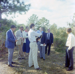 Businesspeople Stand in Field for M-C Development, P by George Skip Gandy IV