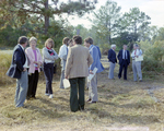 Businesspeople Stand in Field for M-C Development, R by George Skip Gandy IV