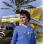 Woman Outside Yellow A-frame Home for Midland-Guardian of Tampa, B by George Skip Gandy IV
