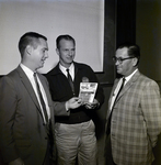 Three Men Hold Donation Box for March of Dimes at Coca Cola Plant, B by George Skip Gandy IV