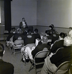 Unidentified Man Holding Donation Box and Speaking for March of Dimes at Coca Cola Plant, A by George Skip Gandy IV