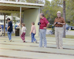 Men with Cameras on Shuffleboard Court at Marion Oaks Country Club by George Skip Gandy IV