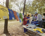 People Browsing T-shirts at Marion Oaks Country Club, A by George Skip Gandy IV