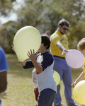 Children Holding Balloons at Marion Oaks Country Club, A by George Skip Gandy IV
