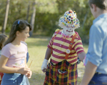 Clown Standing with Children at Marion Oaks Country Club, B by George Skip Gandy IV
