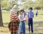 Clown Standing with Children at Marion Oaks Country Club, C by George Skip Gandy IV