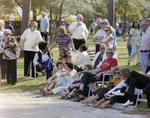 People Sitting and Talking outside at Marion Oaks Country Club by George Skip Gandy IV