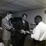 Three Men Standing Together for Master Charge, A by George Skip Gandy IV