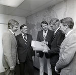 Men Standing with Folder for Master Charge, C by George Skip Gandy IV