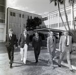 Men Walking outside for Master Charge by George Skip Gandy IV