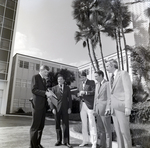 Men Standing outside for Master Charge, A by George Skip Gandy IV