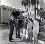 Men Standing outside for Master Charge, B by George Skip Gandy IV