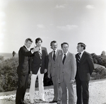 Men Standing outside for Master Charge, D by George Skip Gandy IV