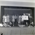 People on Stage with 10th Anniversary Sign for Master Charge, A by George Skip Gandy IV
