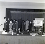 People on Stage with 10th Anniversary Sign for Master Charge, C by George Skip Gandy IV