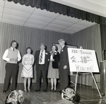 People on Stage with 10th Anniversary Sign for Master Charge, L by George Skip Gandy IV