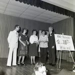 People on Stage with 10th Anniversary Sign for Master Charge, P by George Skip Gandy IV
