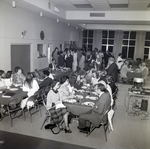 People Dining at Tables for Master Charge, C by George Skip Gandy IV