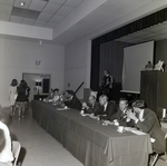 People Dining at Panel Table for Master Charge, B by George Skip Gandy IV