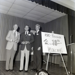 People on Stage with 10th Anniversary Sign for Master Charge, Q by George Skip Gandy IV